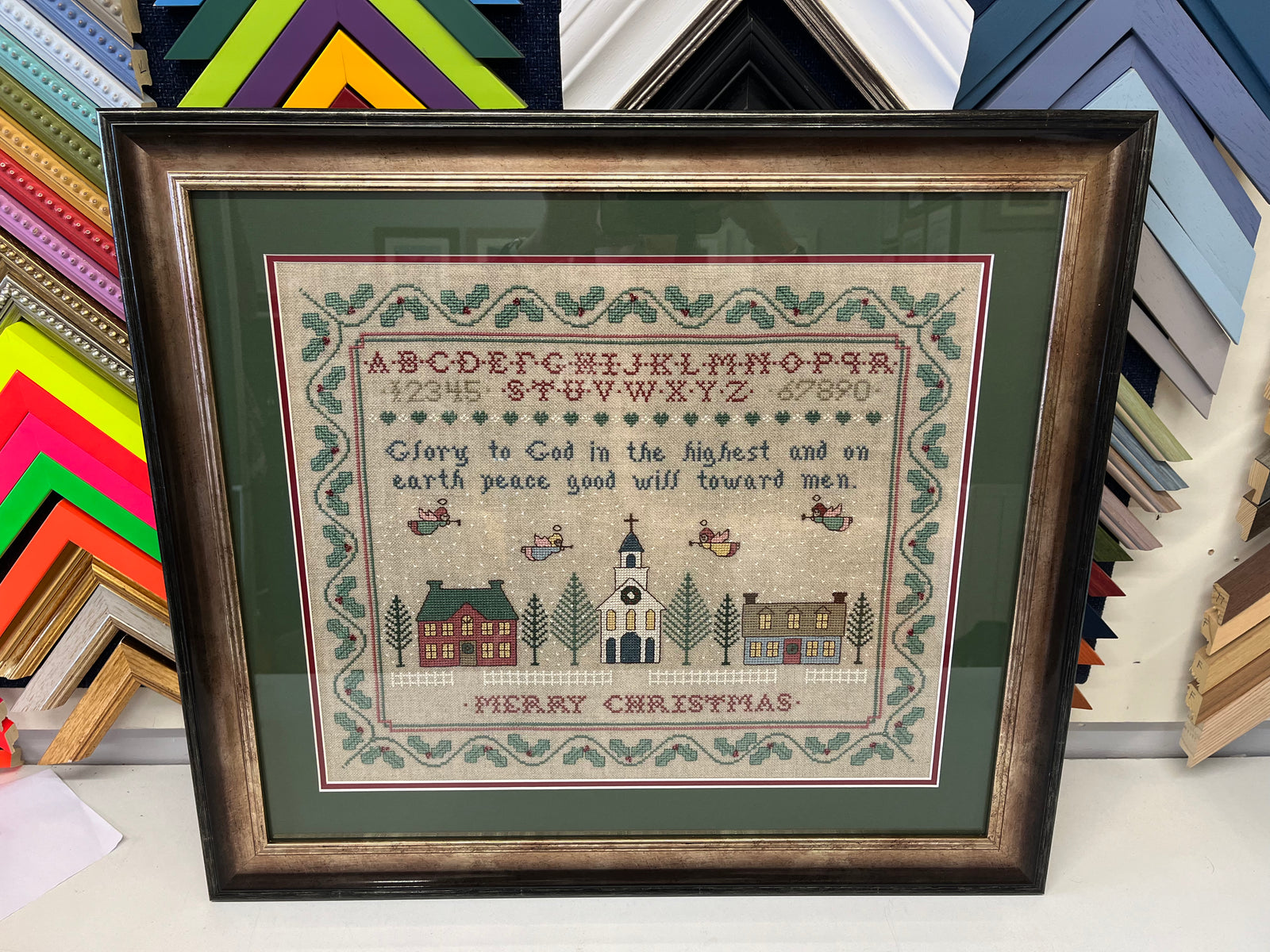 A framed cross stitch